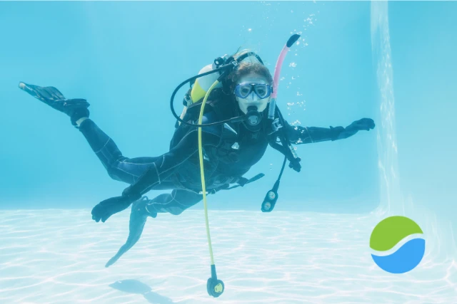 SCUBA pool A single scuba diver swims underwater